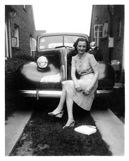 Christine sitting on a car 1939