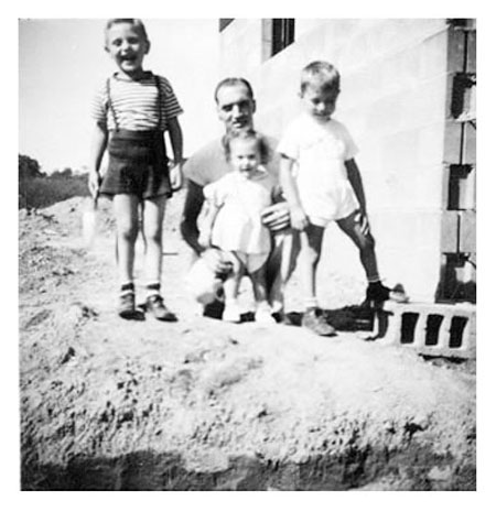 Freer with children back of house 1947